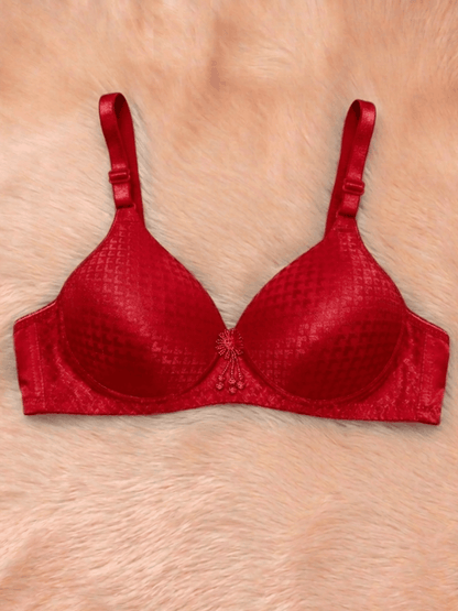 Red bra on a person's chest with a neutral background